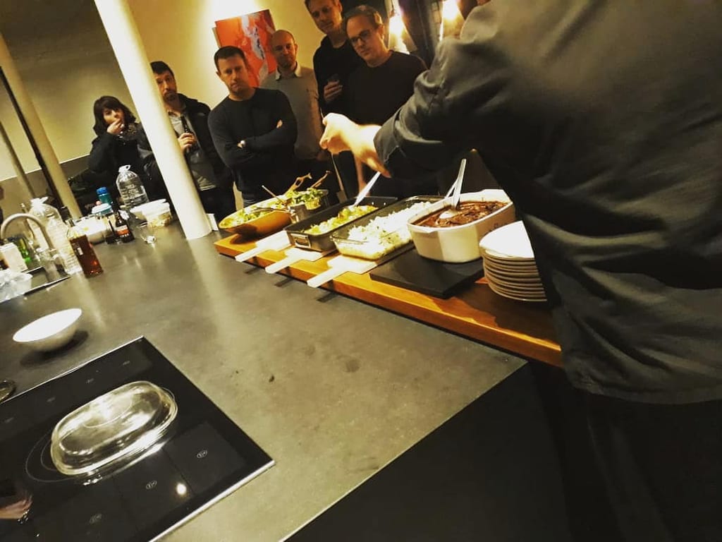 Café Zest chefs plating dishes at a chef’s-table event